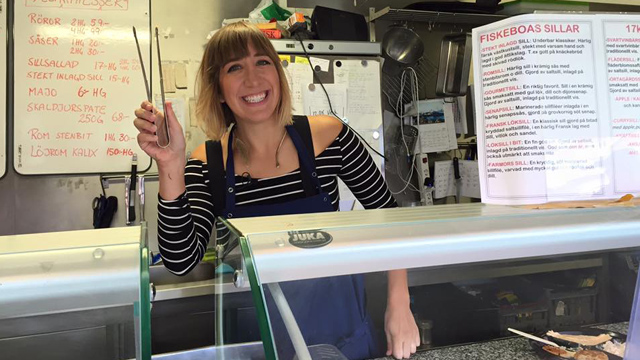 Host Kira Cook at a fish shop in Sweden